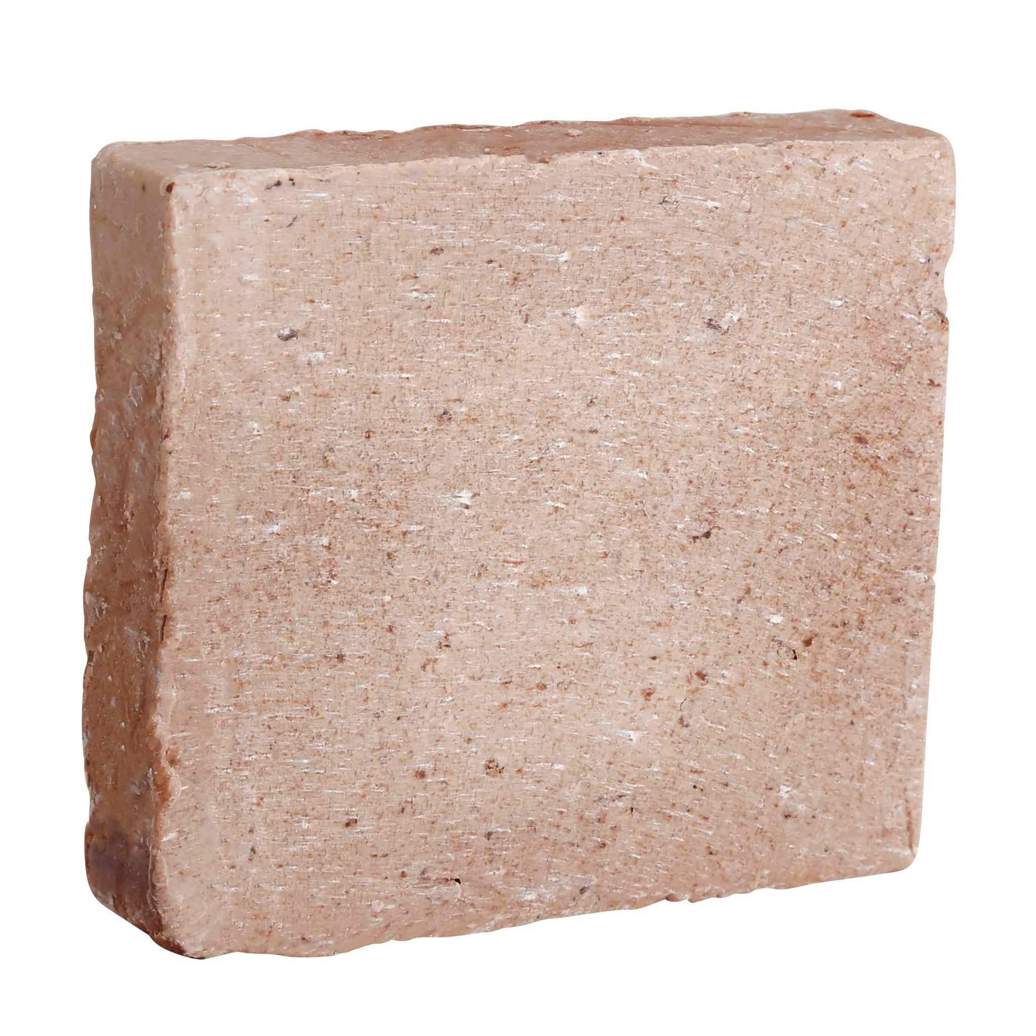 Bar of Coconut & Cream Natural Soap with exfoliating coconut flakes and creamy lather for soft, hydrated skin