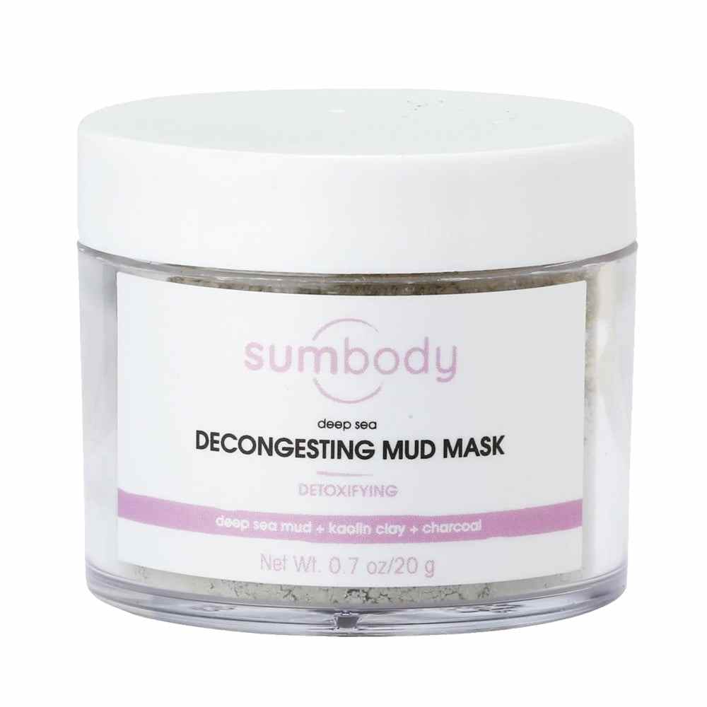 Deep Sea Decongesting Mud Mask powder container with natural ingredients background