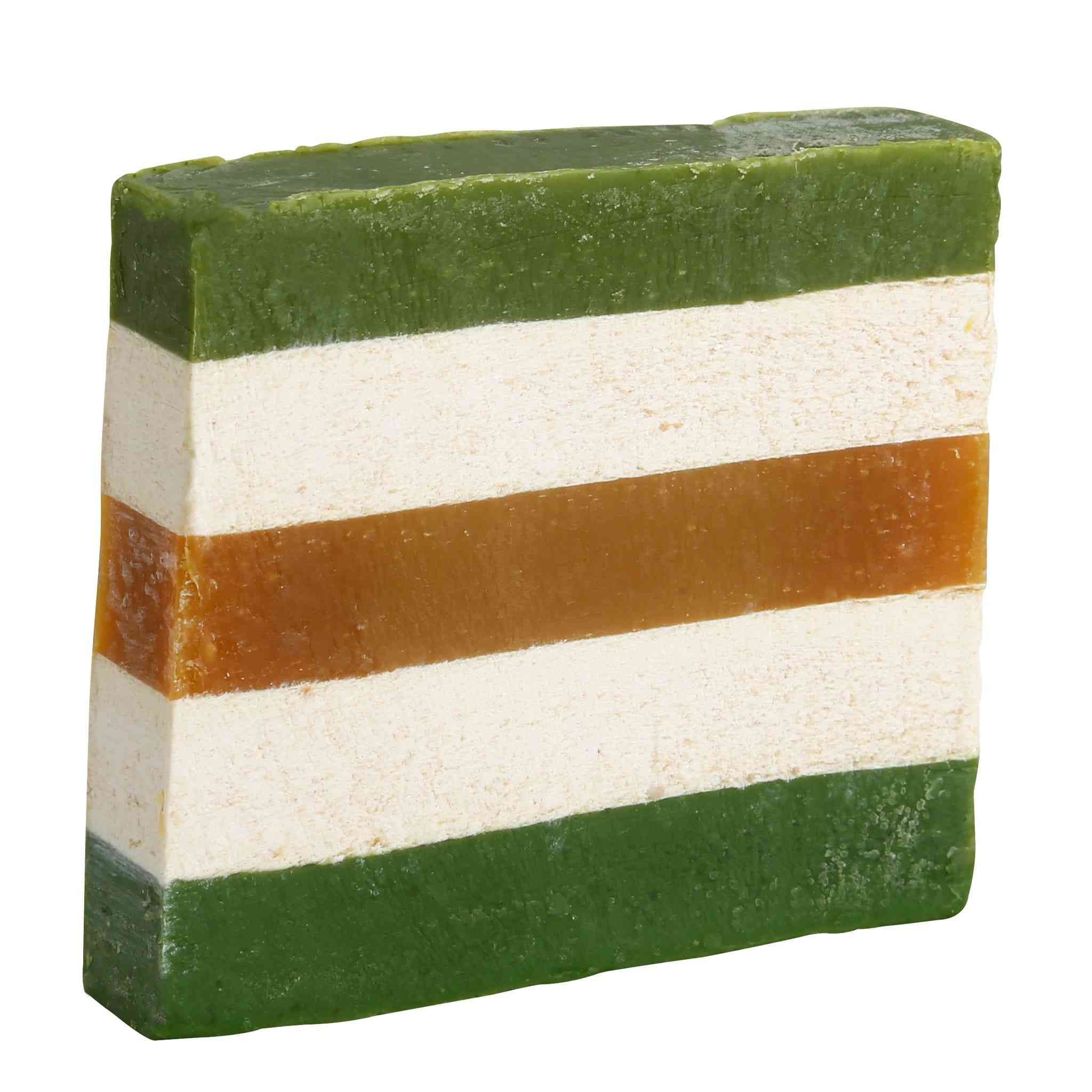 Goats beside avocado natural soap bars promoting hydrating goat milk soap benefits