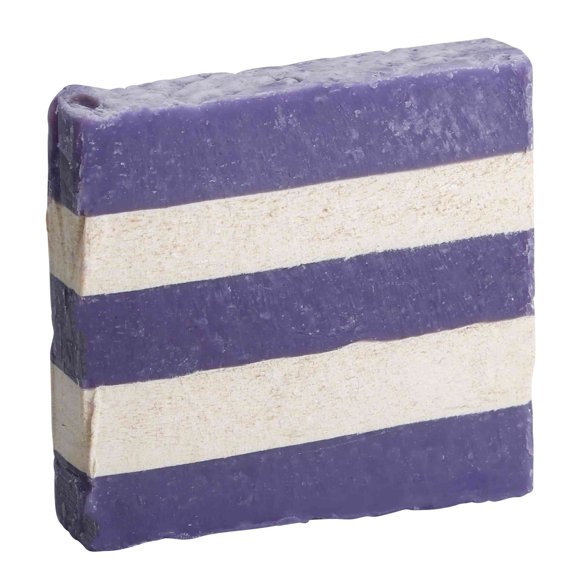 Goats in lavender field near natural handmade soap bars