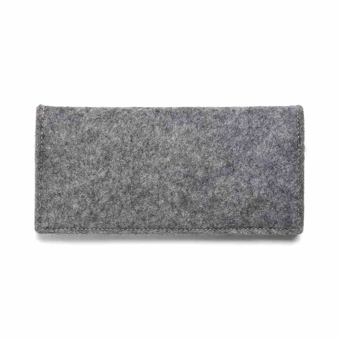 Spacious travel wallet made of natural wool felt and vegetable tanned leather for passport and checkbook storage