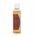 Bottle of Potion #9 Massage Oil with apricot, jojoba, damiana, rose, vanilla, and cinnamon ingredients